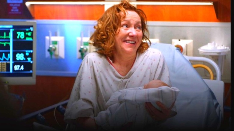 Julie White in hospital bed with baby