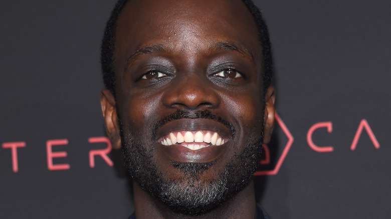 Ato Essandoh smiling into camera