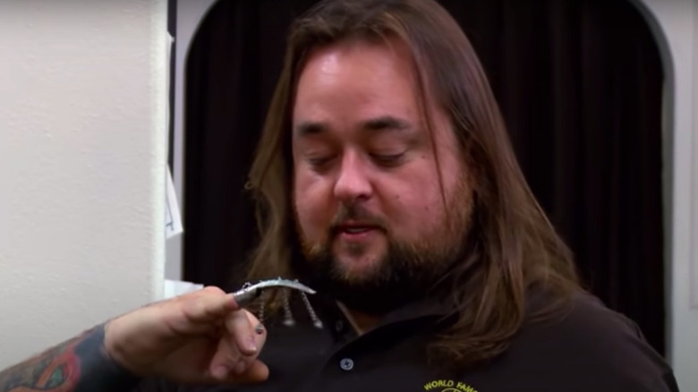 Chumlee wearing Chinese fingernail guard