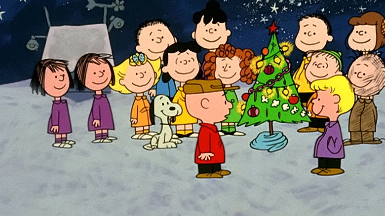 Charlie Brown and friends around the Christmas tree