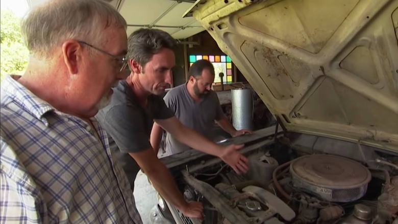 Mike and Frank looking at an old Ford