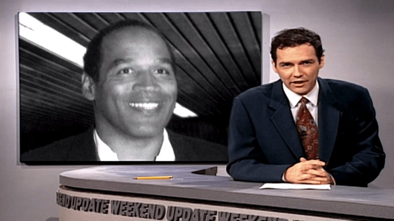 Norm Macdonald speaks in front of O.J. Simpson