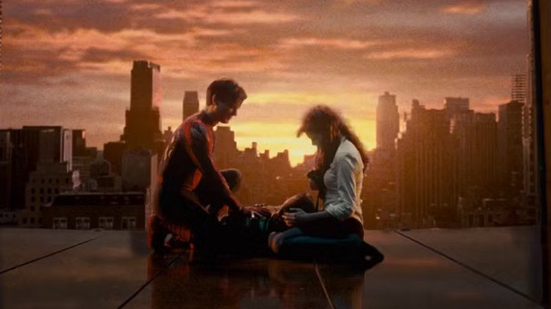 Peter and M.J. kneel over Harry's body in Spider-Man 3 (2007)