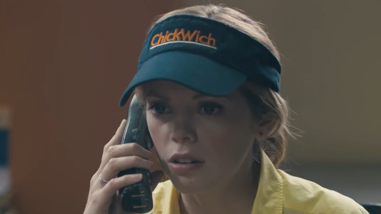 Becky looking worried on the phone