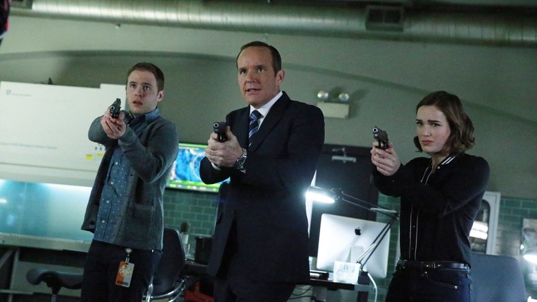 Clark Gregg with his weapon drawn