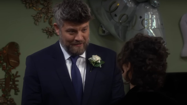 Ben smiling at Darlene during their wedding