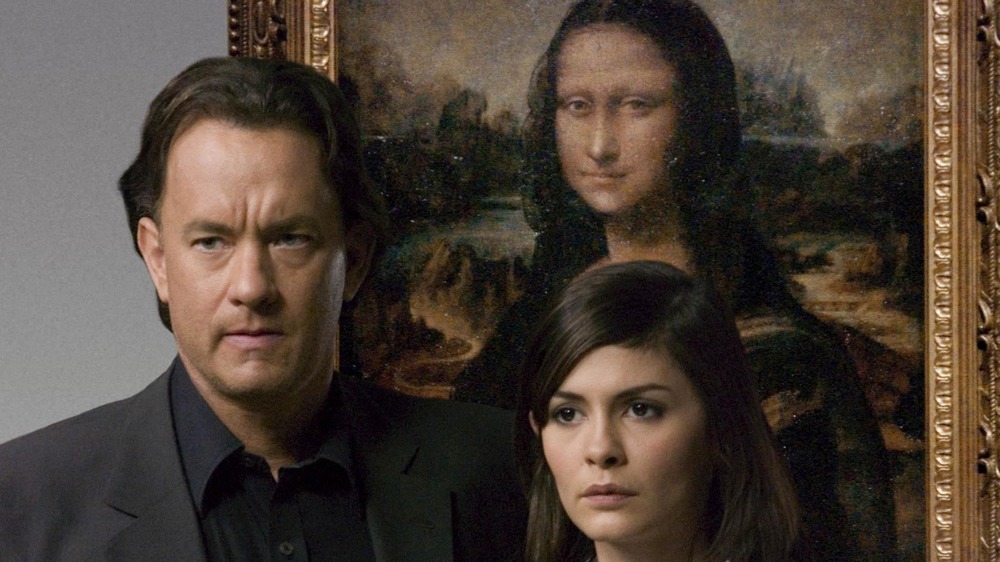 Robert Langdon and Sophie Neveu in front of Mona Lisa