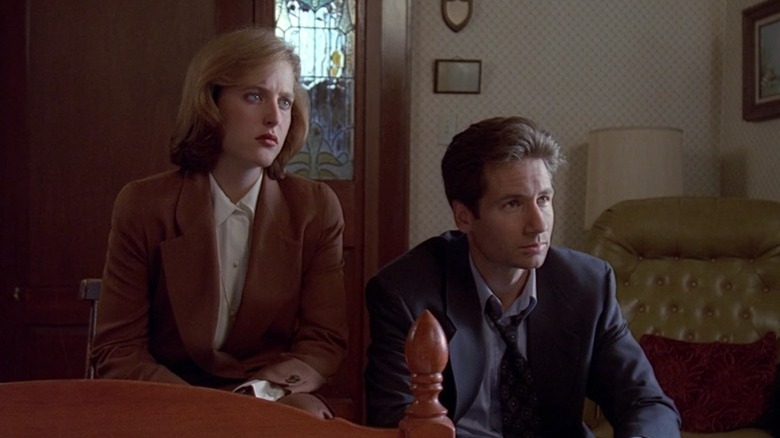 Mulder and Scully listening on The X-Files