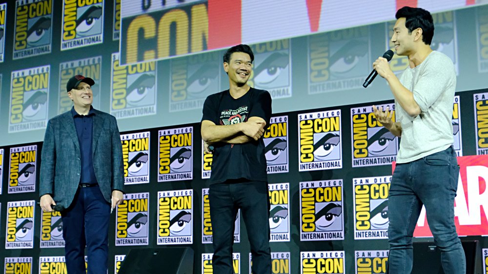 Kevin Feige, Destin Daniel Cretton, and Simu Liu at San Diego Comic-Con 2019