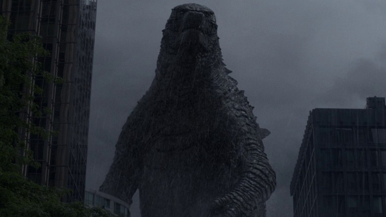 Godzilla moving through a city