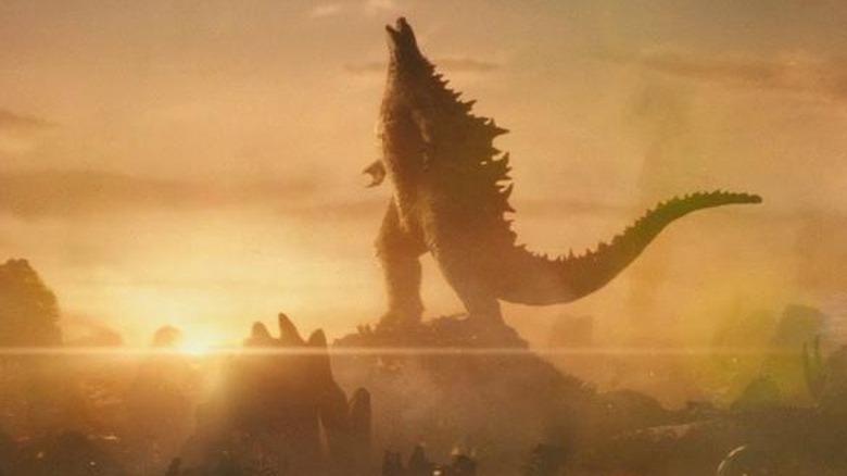 Godzilla triumphantly lording over monsters