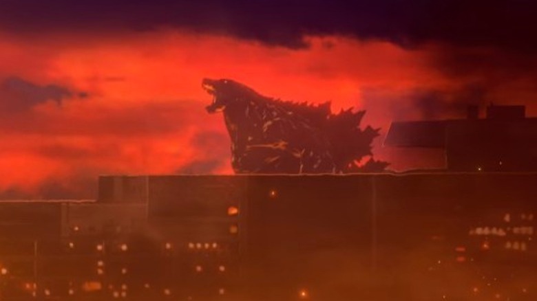 Godzilla growling over city