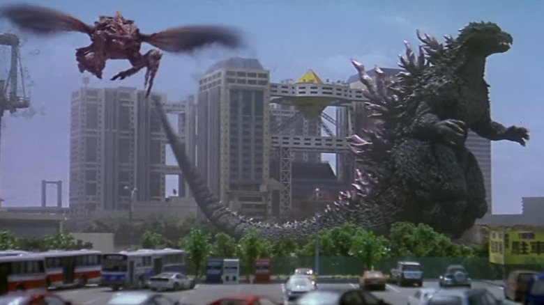 Godzilla fighting Megaguirus in city