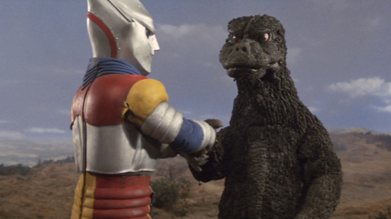 Godzilla and Megalon shake hands