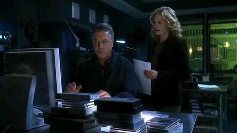 Gil Grissom and Catherine Willows in the lab