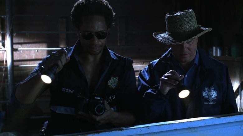 CSI agents with flashlights