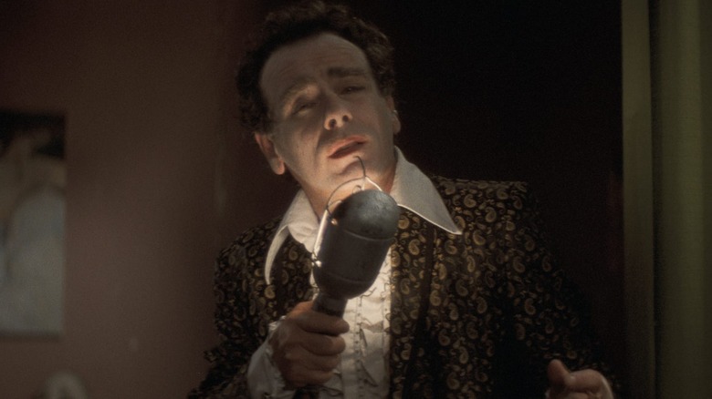 Dean Stockwell crooning into microphone