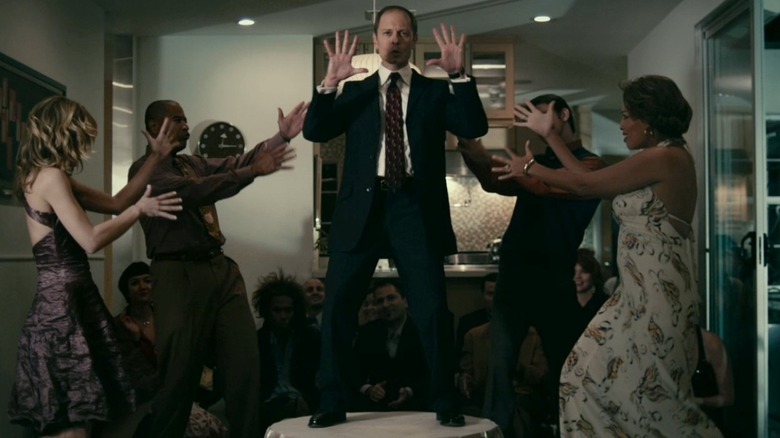 David Hyde Pierce dancing on table