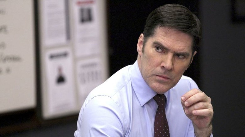 Hotch sitting and looking serious