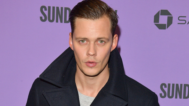 Bill Skarsgård wearing peacoat