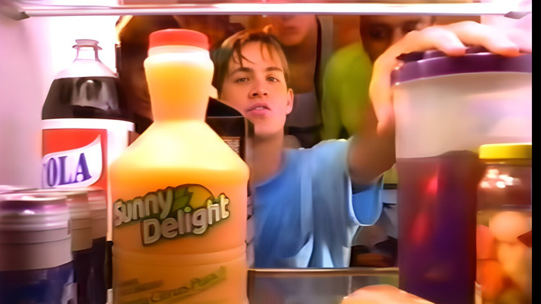 Guys looking at Sunny Delight in the fridge