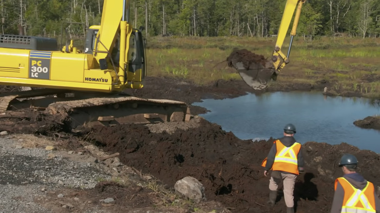 The team excavates the swamp