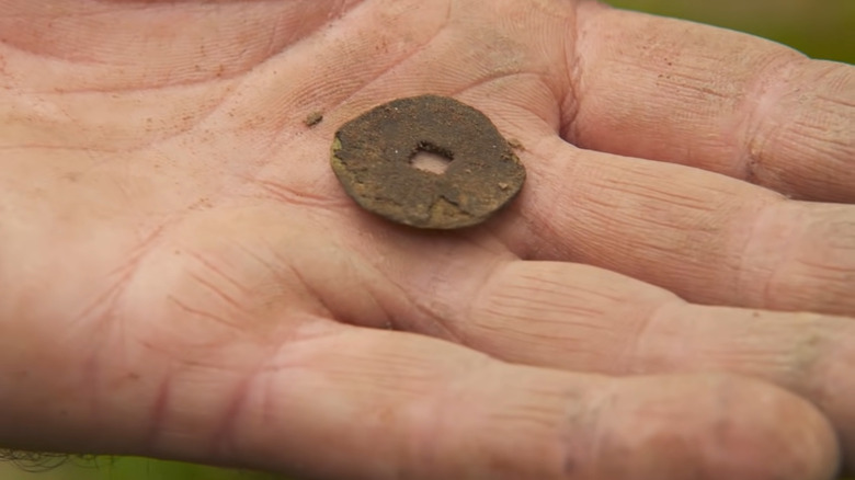 Gary Drayton holds Chinese coin