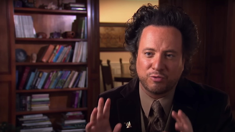 Giorgio A. Tsoukalos hands up