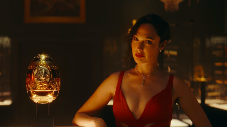 Gal Gadot next to a golden egg. 