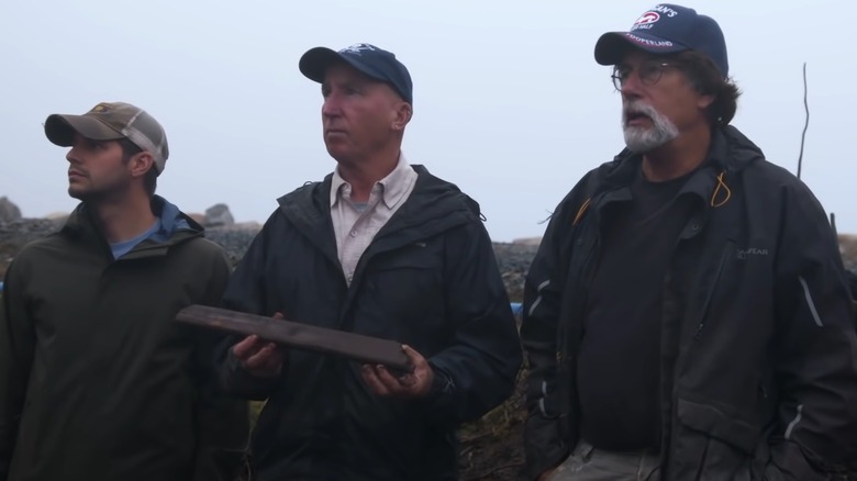 Oak Island cast standing outside