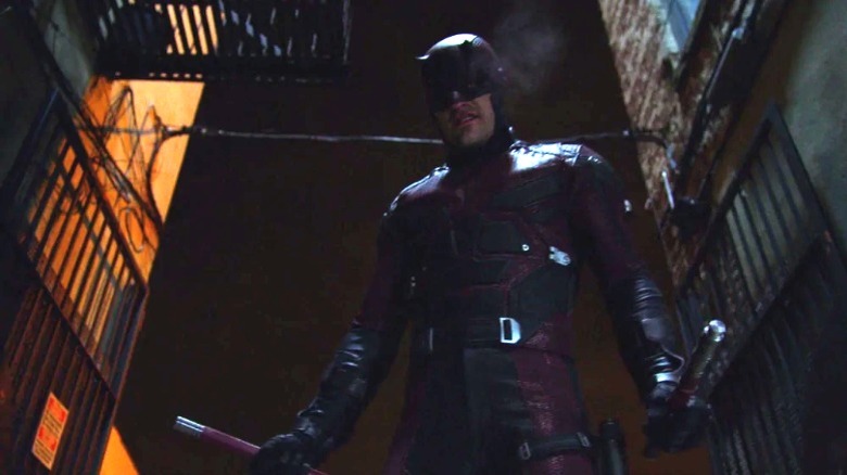 Daredevil standing holding his batons in each hand