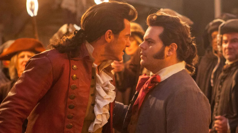 Luke Evans and Josh Gad face to face