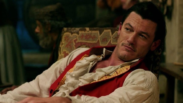 Luke Evans leaning back in chair