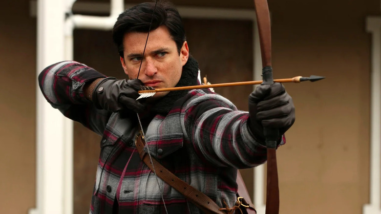 Gaston shooting arrow