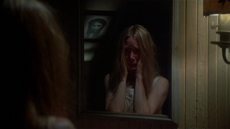 Carrie White looks in mirror
