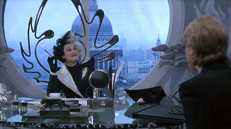 Cruella at her desk talking to Anita