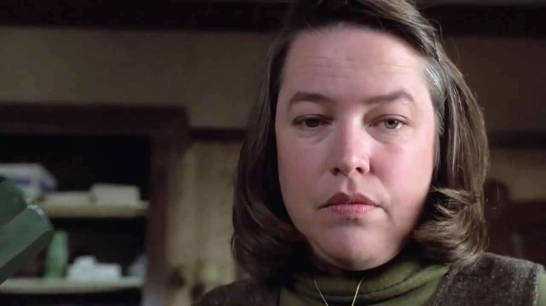 Annie Wilkes calmly brandishes a sledgehammer