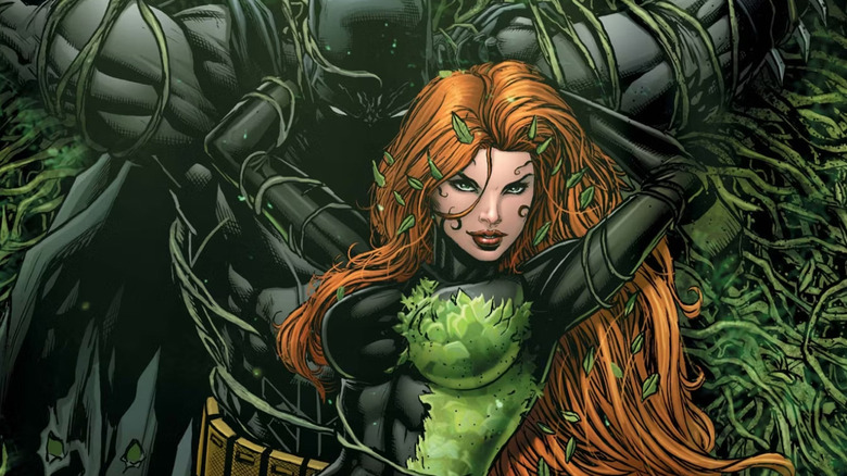 Poison Ivy has Batman tied in vines