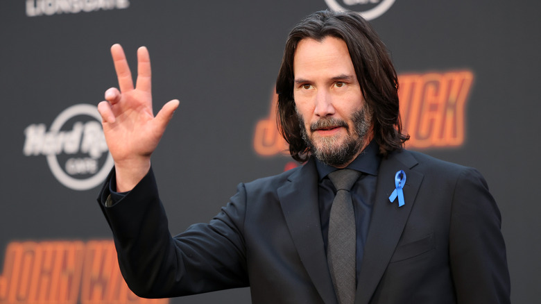 Keanu Reeves waving