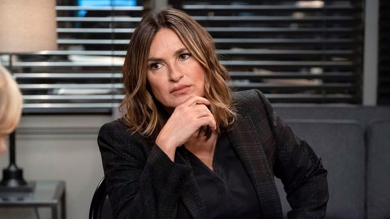 Benson at a desk 