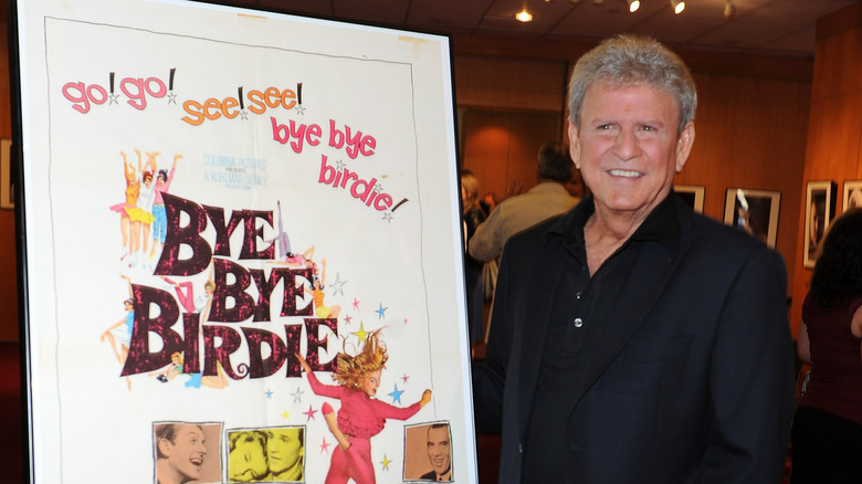 Bobby Rydell next to a Bye Bye Birdie poster