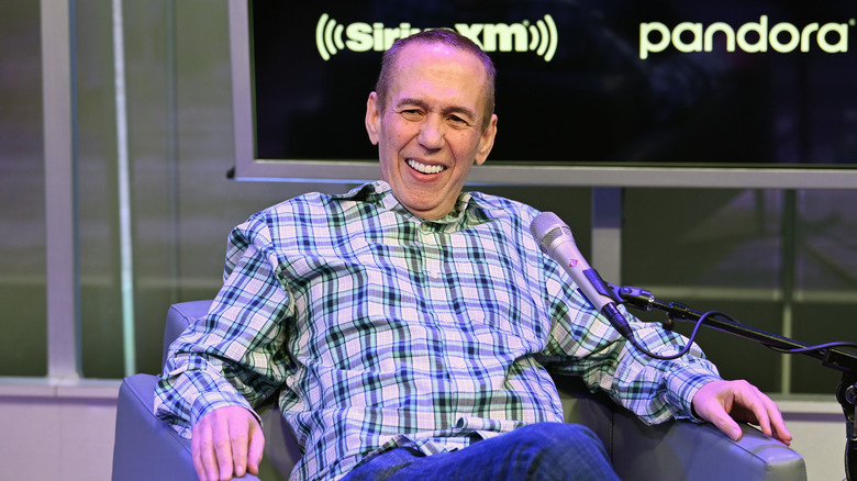 Gilbert Gottfried wears plaid shirt