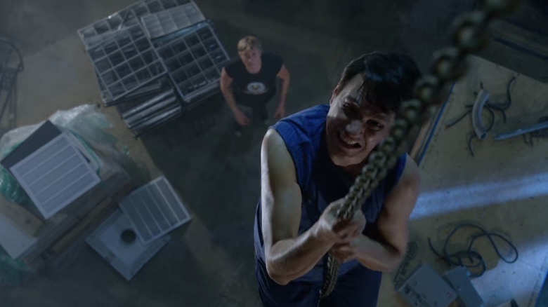 Ralph Macchio climbing in Cobra Kai