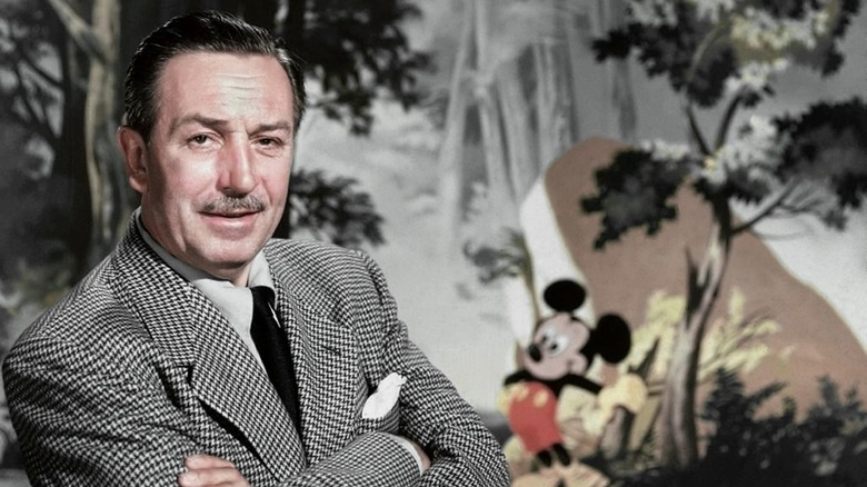 Walt Disney with his arms crossed