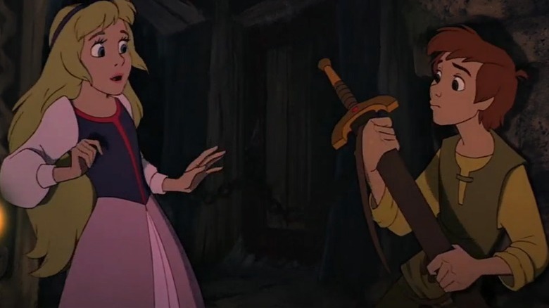 Taran and Princess Eilonwy look at a sword