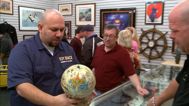 Johnny from Toy Shack inspecting Disney toy on Pawn Stars