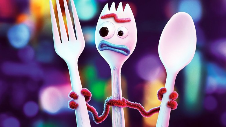 Forky holding a fork and spoon in Toy Story 4