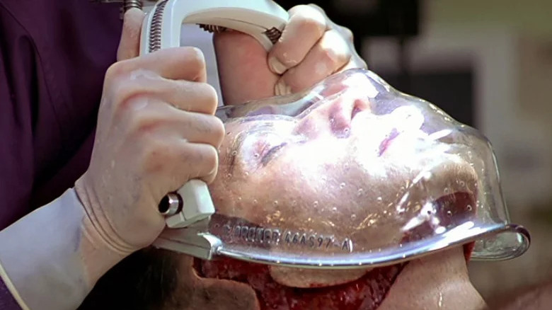 John Travolta's face being removed