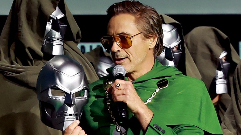Robert Downey Jr. holding Doom mask
