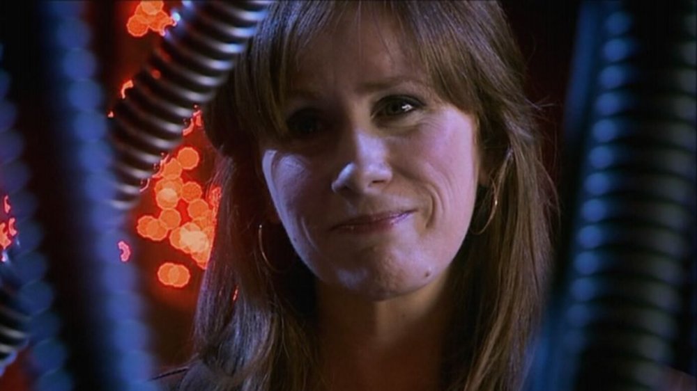 Catherine Tate smiles through a bunch of cables as Donna Noble in Doctor Who